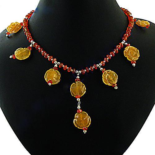 A beautiful Red Onyx and Yellow Aventurine Stone necklace featuring faceted beads and 925 silver accents, showcasing vibrant colors and elegant design.