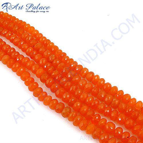 A strand of vibrant red onyx loose beads, showcasing their smooth surface and rich color, perfect for jewelry making.