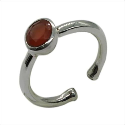 A beautifully crafted Red Onyx Stone 925 Silver Ring featuring a simple yet fancy cutstone design, showcasing its vibrant red color and shiny silver band.