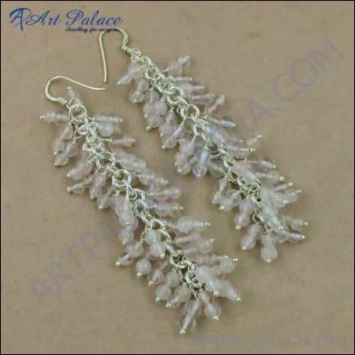 Elegant Rocking Style Rose Quartz Gemstone Silver Earrings showcasing a beautiful design with shimmering rose quartz stones set in silver.