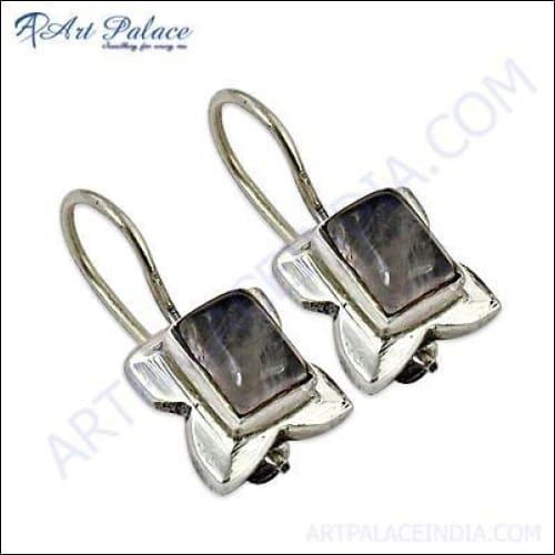 Elegant rose quartz gemstone silver earrings with a delicate design, perfect for adding a touch of sophistication to any outfit.