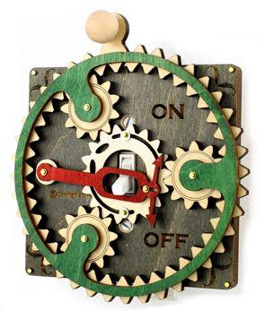 Gray and Green Single Planetary Switch Plate 8002E with gear handle, designed for standard light switches.