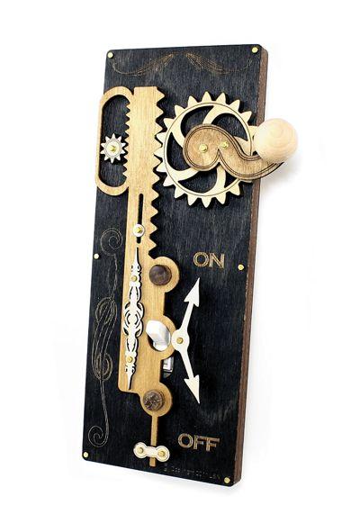 Black Single Rack & Pinion Switch Plate 8000D with gear handle, showcasing a sleek design and wood accents.