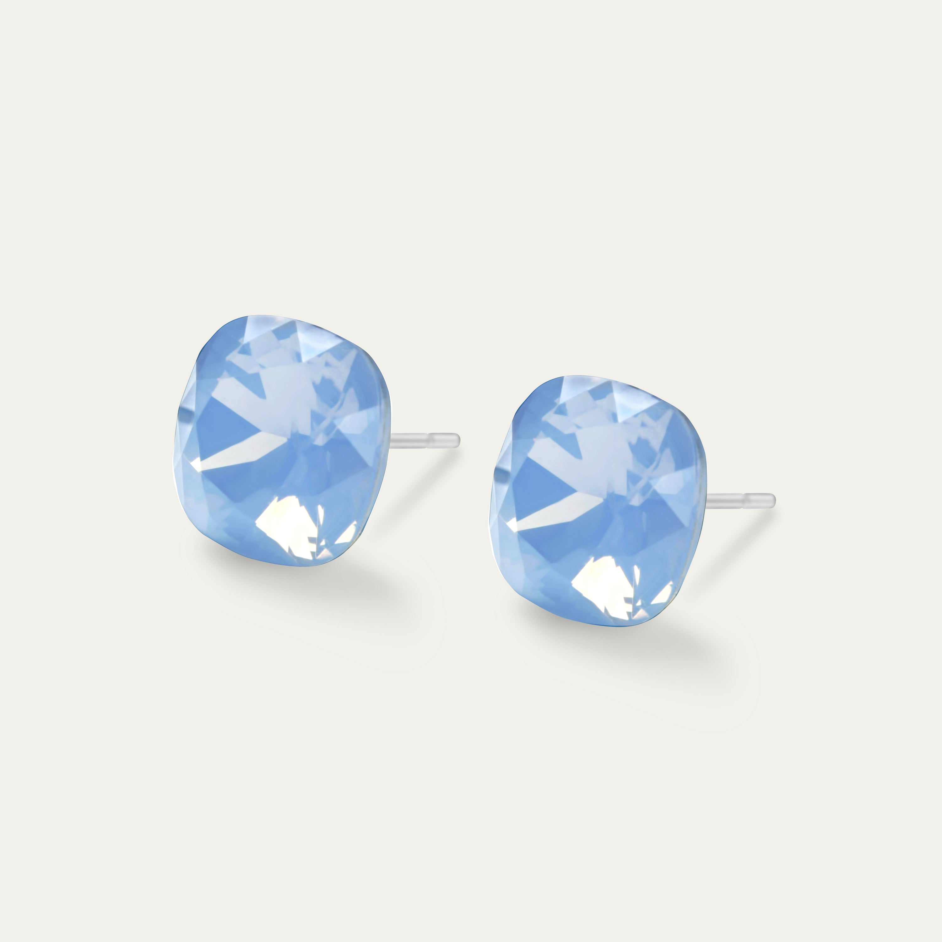 Sophia Air Blue Opal earrings featuring 10mm blue color crystal cushion set in hypoallergenic stainless steel, showcasing elegance and sparkle.