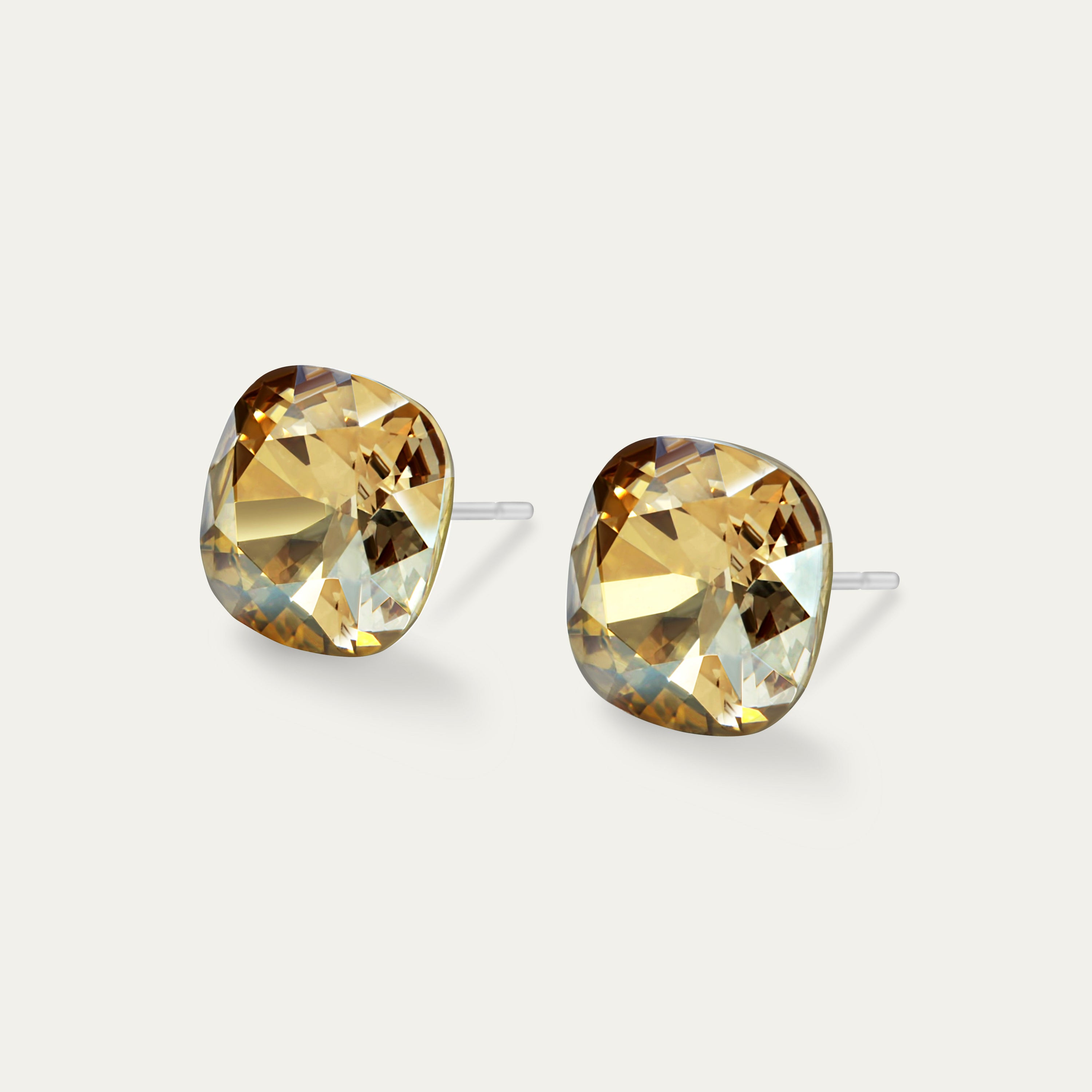 Sophia Golden Shadow 10mm Gold Color Crystal Cushion earrings on a white background, showcasing their elegant design and sparkle.