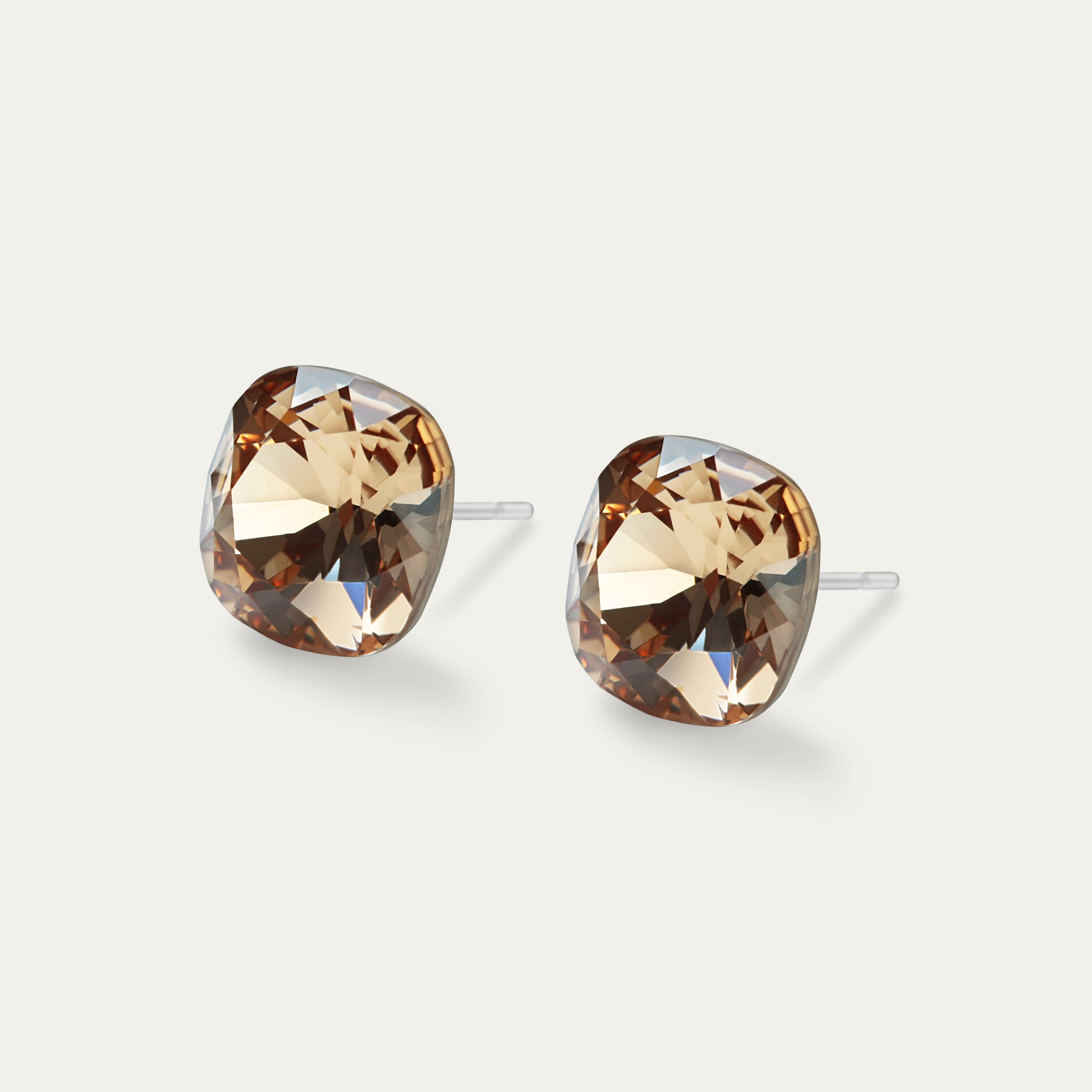 Sophia Light Col Topaz 10mm Brown Crystal Cushion earrings on a white background, showcasing their elegant design and sparkle.