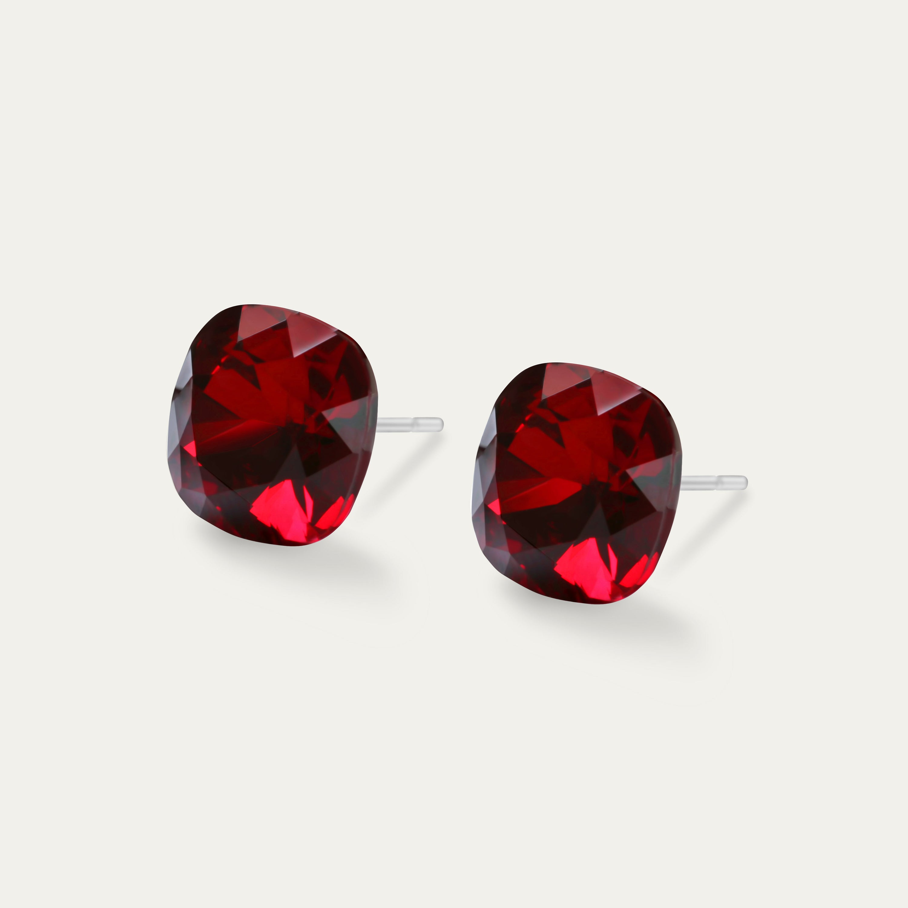 Sophia - Siam 10mm Red Color Crystal Cushion Earrings on a soft background, showcasing their elegant design and sparkle.