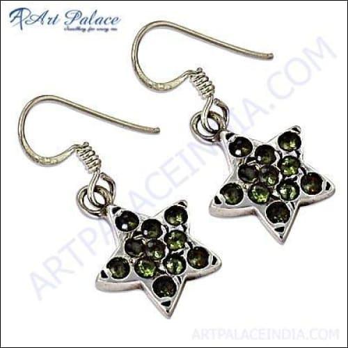 Star-shaped peridot gemstone silver hook earrings showcasing vibrant green stones and elegant design.