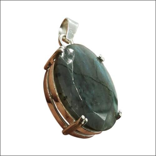 A stunning round ornamental pendant featuring a labradorite gemstone set in 925 silver, showcasing its iridescent colors.