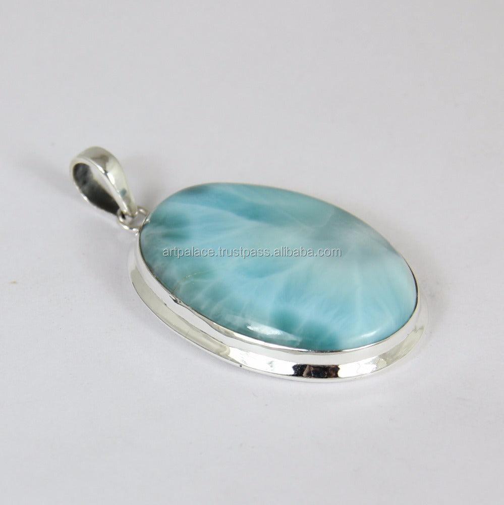 A stunning 925 sterling silver pendant featuring a natural Larimar gemstone, showcasing its beautiful blue hues and elegant design.