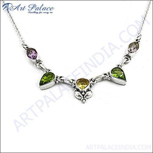 A stunning silver necklace featuring vibrant amethyst, citrine, and peridot gemstones, showcasing exquisite craftsmanship and elegance.
