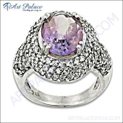 Stunning silver ring featuring a central amethyst stone surrounded by cubic zirconia accents, perfect for party wear.