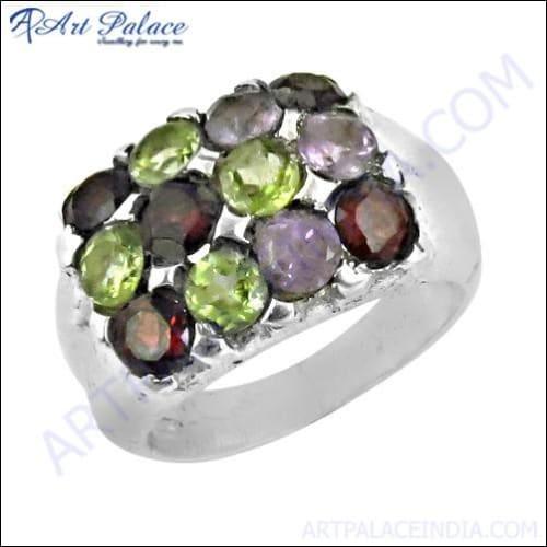 A stunning silver ring featuring Amethyst, Garnet, and Peridot gemstones, showcasing intricate craftsmanship and vibrant colors.