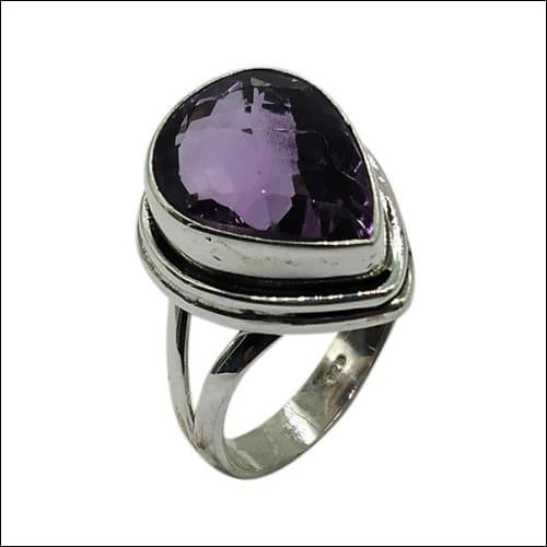 A stunning pear-shaped Amethyst gemstone ring set in 925 sterling silver, showcasing its regal purple hue and elegant design.