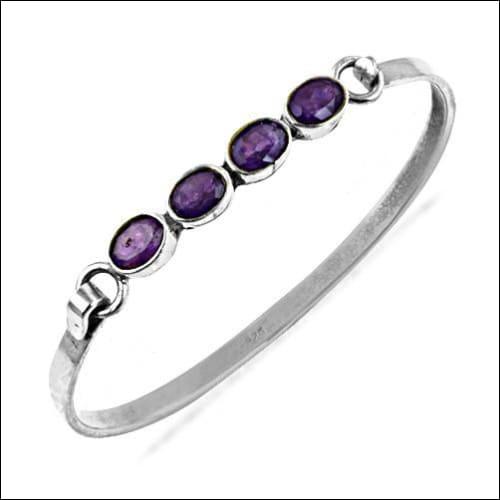 A pair of stunning amethyst gemstone silver bangles crafted from 925 sterling silver, showcasing intricate design and vibrant purple hues.