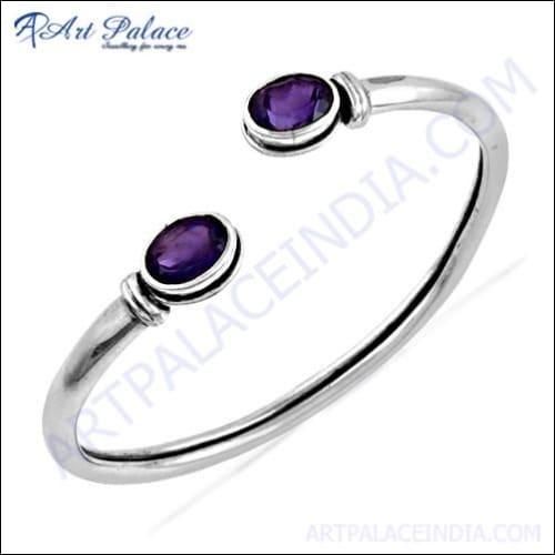 Stunning silver bangles featuring captivating amethyst gemstones, showcasing elegance and craftsmanship.