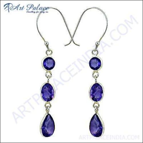 Elegant silver dangle earrings featuring genuine amethyst gemstones, showcasing their deep purple color and intricate design.