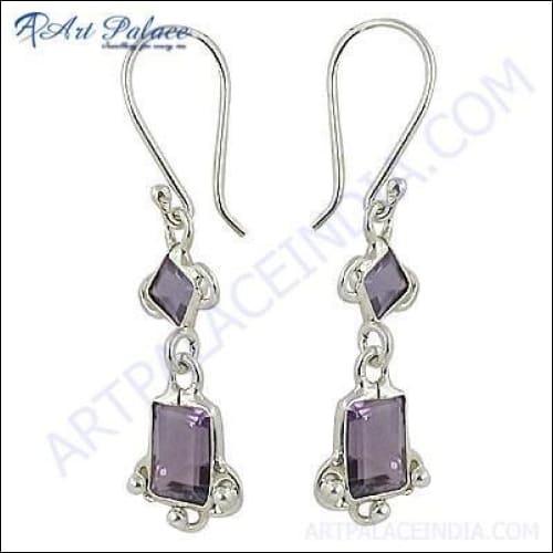 A pair of stunning silver earrings featuring beautiful amethyst gemstones, showcasing intricate design and craftsmanship.