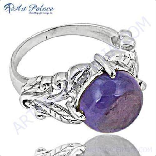 A stunning silver ring featuring a vibrant amethyst gemstone, showcasing its elegant design and craftsmanship.