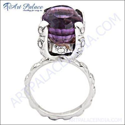 A stunning sterling silver ring featuring a vibrant amethyst gemstone, showcasing intricate craftsmanship and elegant design.
