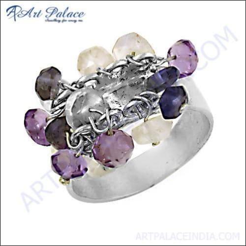 A stunning silver ring featuring Amethyst, Iolite, and Rainbow Moonstone, showcasing vibrant colors and intricate craftsmanship.
