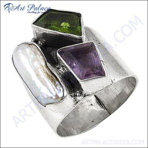 A stunning silver ring featuring Amethyst, Pearl, and Peridot gemstones, showcasing intricate design and craftsmanship.