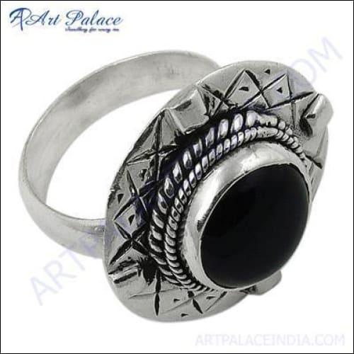 A stunning silver ring featuring a unique black onyx gemstone, showcasing intricate craftsmanship and elegant design.