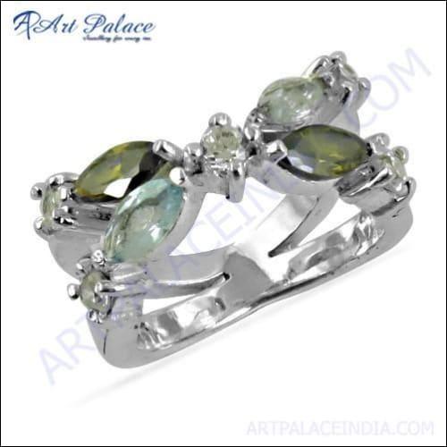 A stunning silver ring featuring a vibrant blue topaz gemstone surrounded by colorful tourmaline accents, showcasing exquisite craftsmanship.