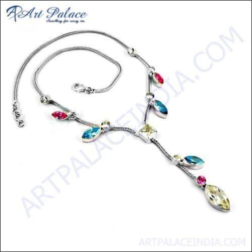 A stunning silver necklace featuring blue, white, and pink zirconia gemstones, showcasing exquisite craftsmanship and elegant design.