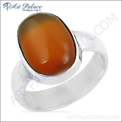 A stunning silver ring featuring a vibrant carnelian gemstone, showcasing intricate craftsmanship and elegant design.