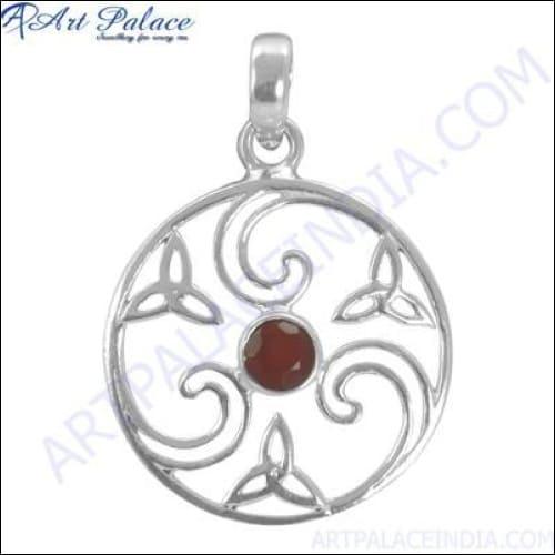 A stunning Celtic pendant featuring a red onyx gemstone set in 925 sterling silver, showcasing intricate knotwork design.