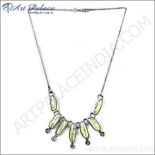 A stunning silver necklace featuring vibrant citrine gemstones and lustrous pearls, showcasing exquisite craftsmanship and elegant design.