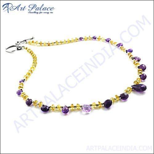 A stunning silver necklace featuring vibrant citrine, garnet, and African amethyst gemstones, elegantly crafted for a luxurious look.