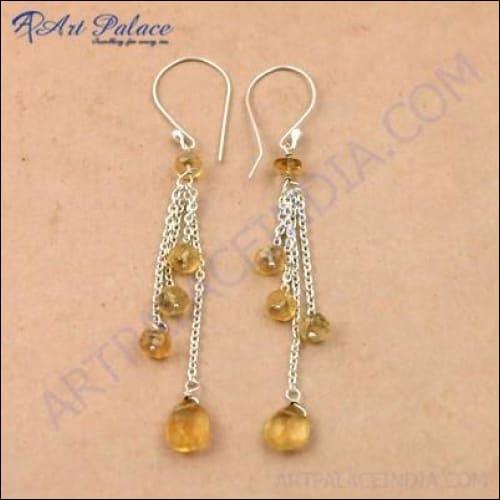 A pair of stunning citrine gemstone silver earrings featuring intricate beaded detailing, showcasing their vibrant yellow color and elegant design.