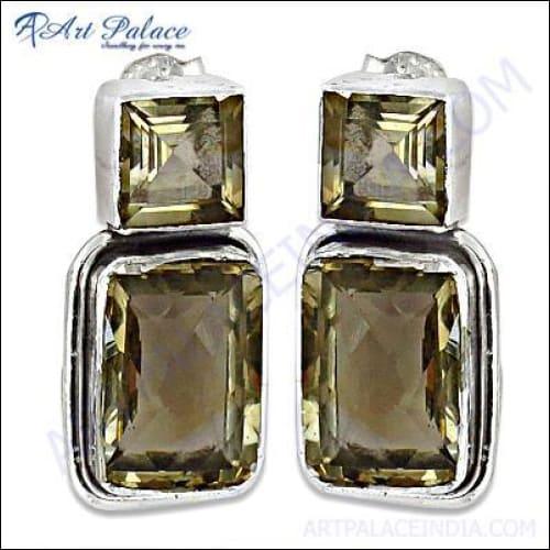 A pair of stunning silver earrings featuring vibrant citrine gemstones, elegantly designed for charm and sophistication.