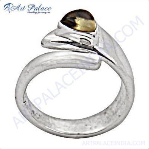 A stunning silver ring featuring a vibrant citrine gemstone, showcasing elegant craftsmanship and design.