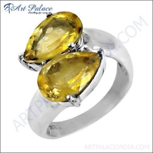A stunning silver ring featuring a vibrant citrine gemstone in an ingenious bypass design, showcasing elegance and craftsmanship.