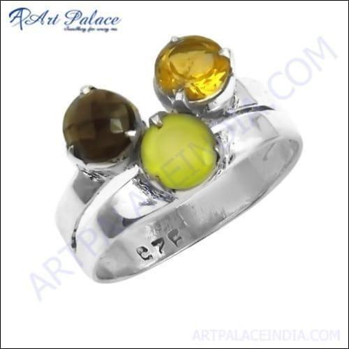 A stunning silver ring featuring citrine, green chalcedony, and smokey quartz gemstones, showcasing intricate craftsmanship and vibrant colors.