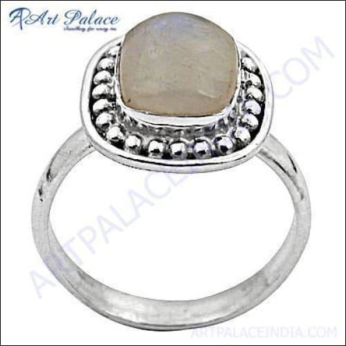 A stunning silver ring featuring clear rainbow gemstones, showcasing intricate craftsmanship and vibrant colors.