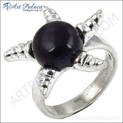 A stunning black onyx gemstone set in a beautifully crafted silver ring, showcasing intricate design and craftsmanship.