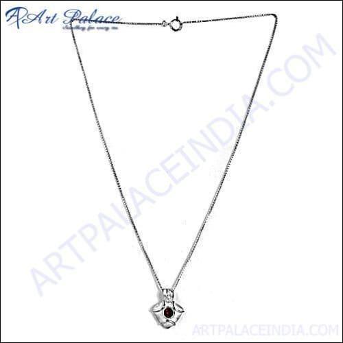 A stunning silver necklace featuring cubic zirconia and garnet stones, elegantly designed for a sophisticated look.