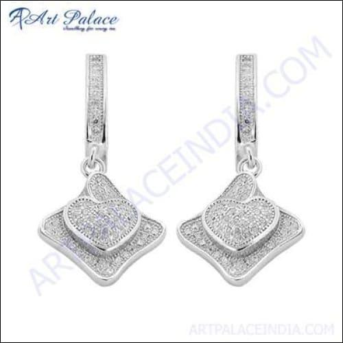 Stunning silver earrings featuring sparkling cubic zirconia gemstones, designed by a famous designer, showcasing elegance and craftsmanship.