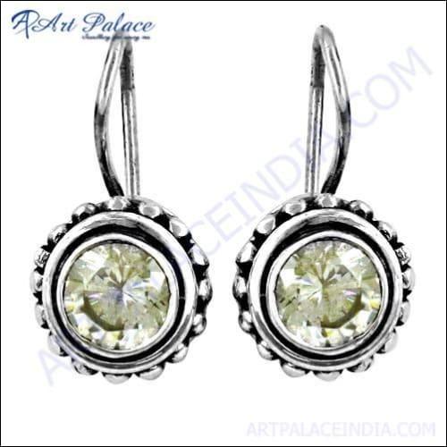 A pair of stunning silver earrings featuring sparkling cubic zirconia gemstones, showcasing elegance and craftsmanship.