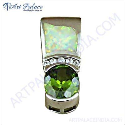 Elegant silver pendant featuring cubic zirconia and peridot, showcasing intricate design and craftsmanship.