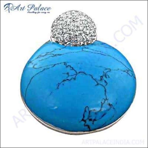 Stunning silver pendant featuring cubic zirconia and turquoise gemstones, showcasing intricate craftsmanship and elegant design.