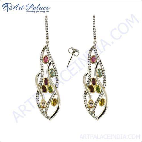 A pair of stunning CZ tourmaline designer silver earrings showcasing intricate craftsmanship and sparkling stones.