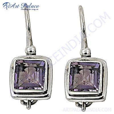 Stunning designer silver earrings featuring unique amethyst gemstones, showcasing intricate craftsmanship and elegant design.
