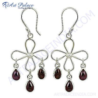 Stunning designer silver earrings featuring vibrant tourmaline gemstones, showcasing intricate craftsmanship and elegant design.