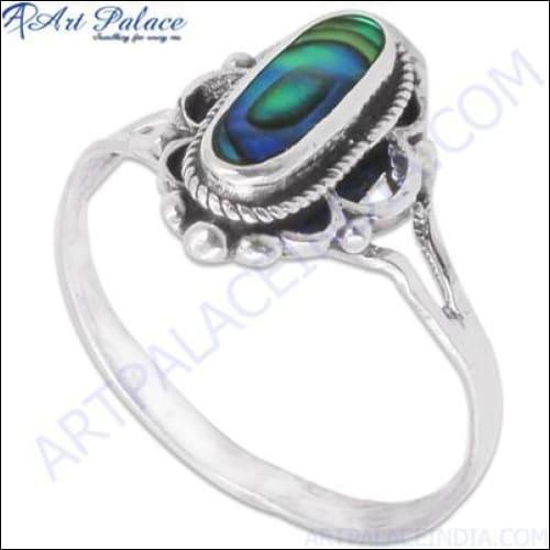 A stunning ethnic designer ring made of 925 sterling silver featuring a vibrant abalone gemstone, showcasing intricate craftsmanship.