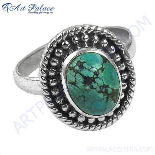 A stunning handmade turquoise silver ring featuring intricate designs and a vibrant turquoise stone, perfect for ethnic and modern styles.